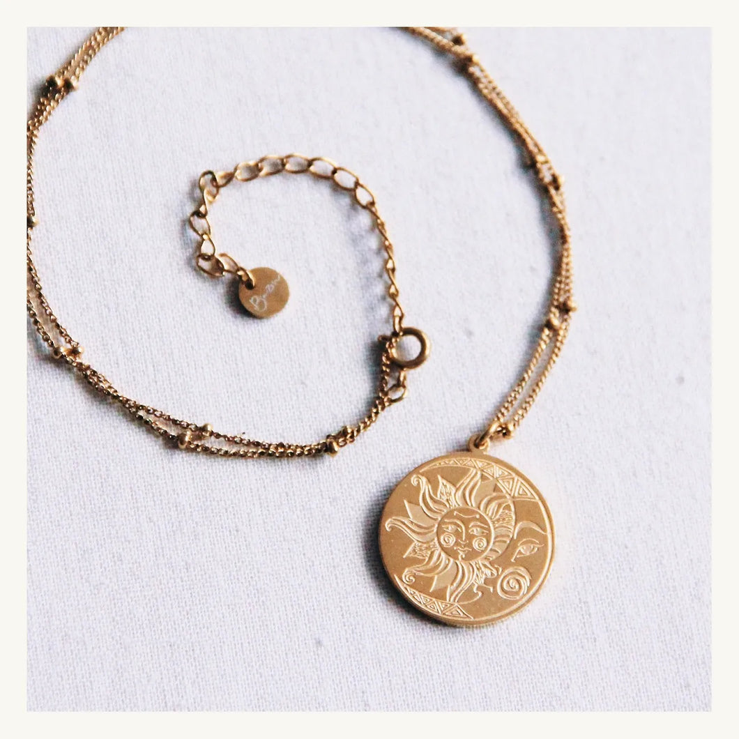 Fine necklace with balls with moon/sun charm